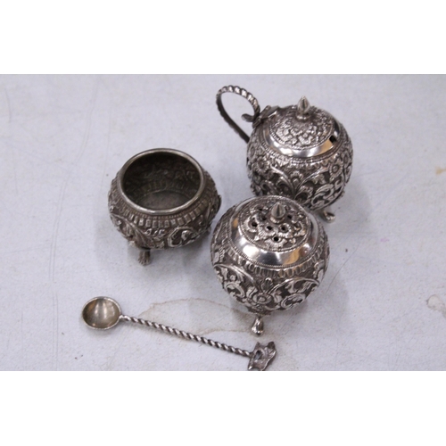 79 - A DECORATIVE FOUR PIECE INDIAN SILVER CRUET SET