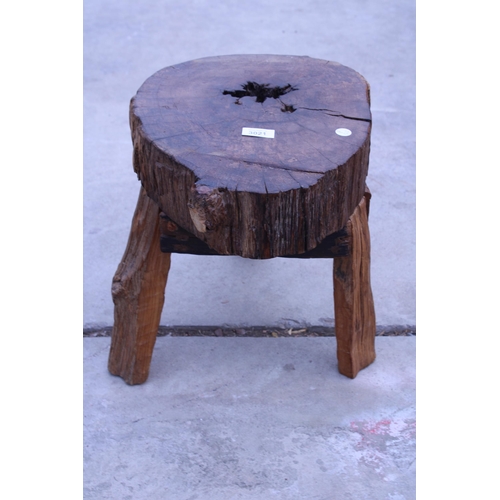 3021 - A VINTAGE LIVE EDGE THREE LEGGED STOOL, 15