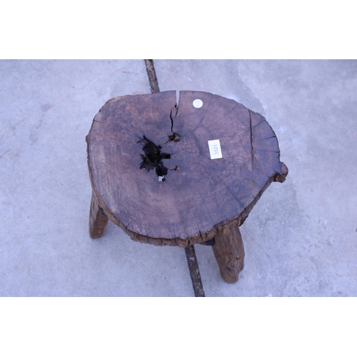 3021 - A VINTAGE LIVE EDGE THREE LEGGED STOOL, 15