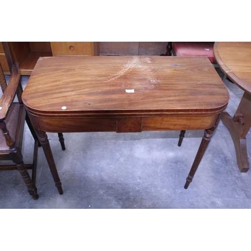 3036 - A 19TH CENTURY MAHOGANY FOLD OVER TEA TABLE ON TURNED AND FLUTED LEGS, 37