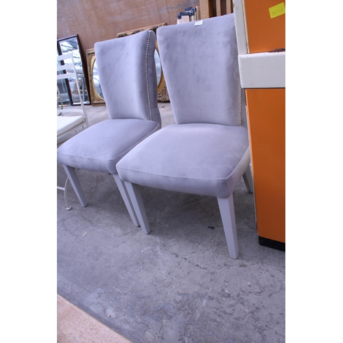 3042 - A PAIR OF MODERN UPHOLSTERED AND PARTIALLY STUDDED DINING CHAIRS