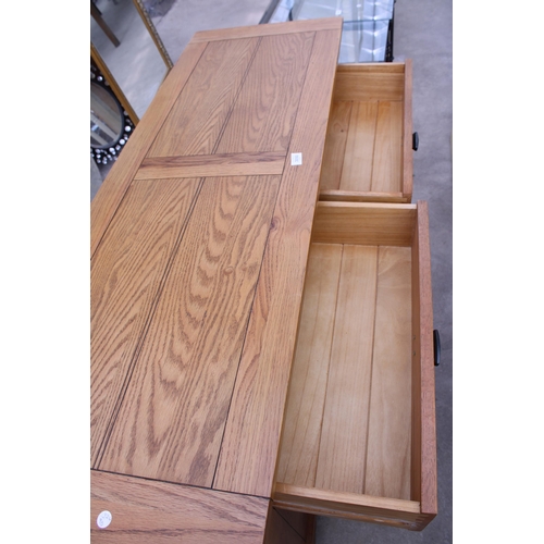 3050 - A MODERN OAK SIDEBOARD ENCLOSING FIVE DRAWERS AND TWO CUPBOARDS 56