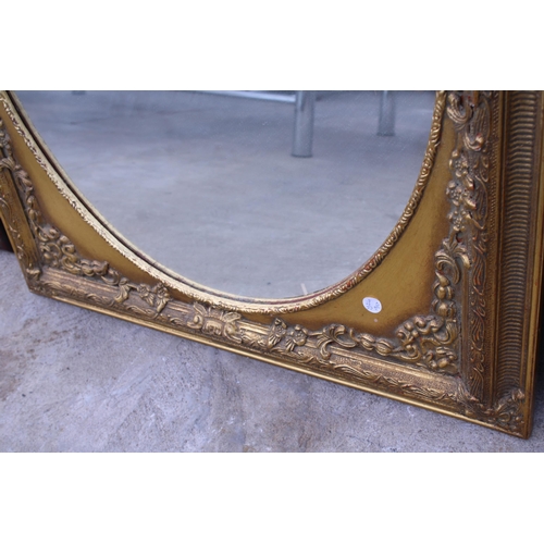 3052 - A 19TH CENTURY STLE GILT OVAL WALL MIRROR  IN A 30X26