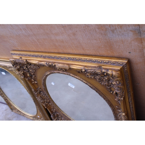 3053 - A 19TH CENTURY STYLE GILT OVAL WALL MIRROR IN A 33X29