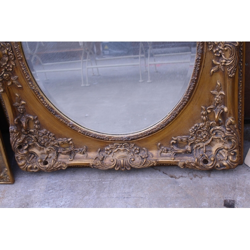 3053 - A 19TH CENTURY STYLE GILT OVAL WALL MIRROR IN A 33X29