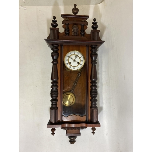 40 - A LATE 19TH CENTURY VIENNA WALL CLOCK WITH PENDULUM