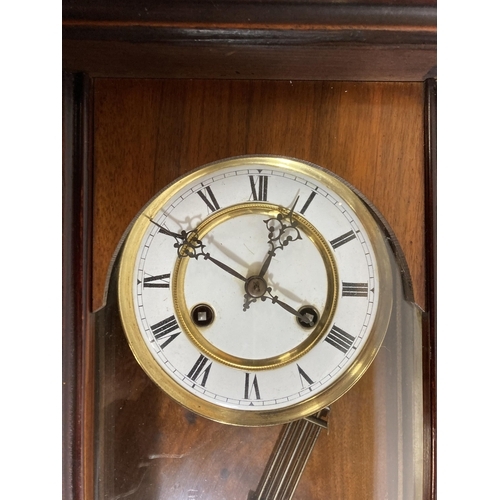 40 - A LATE 19TH CENTURY VIENNA WALL CLOCK WITH PENDULUM