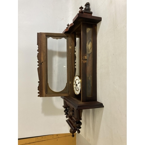 40 - A LATE 19TH CENTURY VIENNA WALL CLOCK WITH PENDULUM