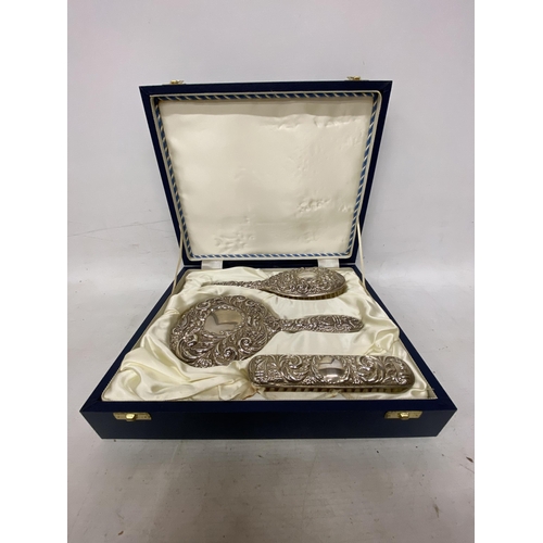 12 - A HALLMARKED BIRMINGHAM BROADWAY AND CO SILVER HAIRBRUSH, MIRROR AND BRUSH SET IN A PRESENTATION BOX