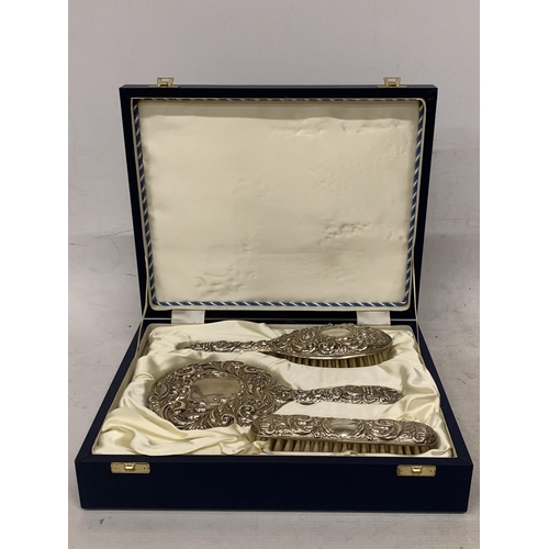 12 - A HALLMARKED BIRMINGHAM BROADWAY AND CO SILVER HAIRBRUSH, MIRROR AND BRUSH SET IN A PRESENTATION BOX