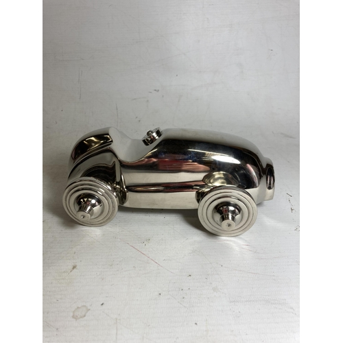 24 - A CHROME MODEL OF A RACE CAR