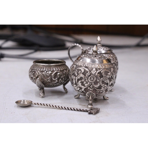 79 - A DECORATIVE FOUR PIECE INDIAN SILVER CRUET SET