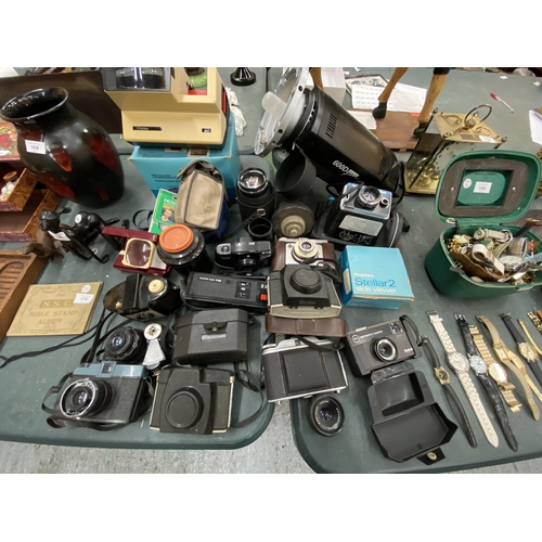 167 - A LARGE LOT OF VINTAGE CAMERAS AND LENSES