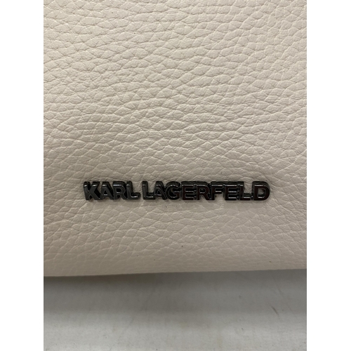 227 - AN AS NEW GENUINE BEIGE COLOURED KARL LAGERFELD BAG