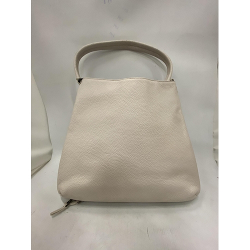 227 - AN AS NEW GENUINE BEIGE COLOURED KARL LAGERFELD BAG