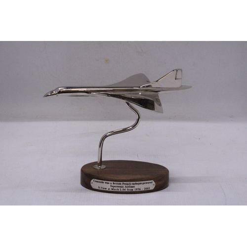 291 - A CHROME CONCORDE ON A WOODEN BASE, HEIGHT 18CM