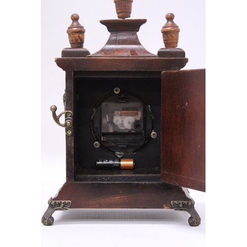 296 - A VINTAGE MAHOGANY CASED MANTLE CLOCK CONVERTED TO BATTERY