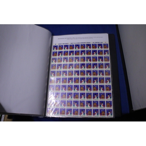 453 - A COLLECTION OF FULL AND PART SHEETS OF WORLD STAMPS IN A RED BINDER