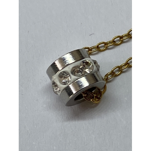 640 - A MARKED AU750 AND TESTED TO 18K NECKLACE WITH A CLEAR STONE PENDANT (BUT NO WARRANTY GIVEN)