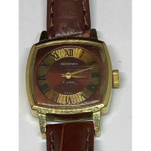 651 - A GOLD PLATED SEKONDA WRIST WATCH WITH LEATHER STRAP SEEN WORKING BUT NO WARRANTY