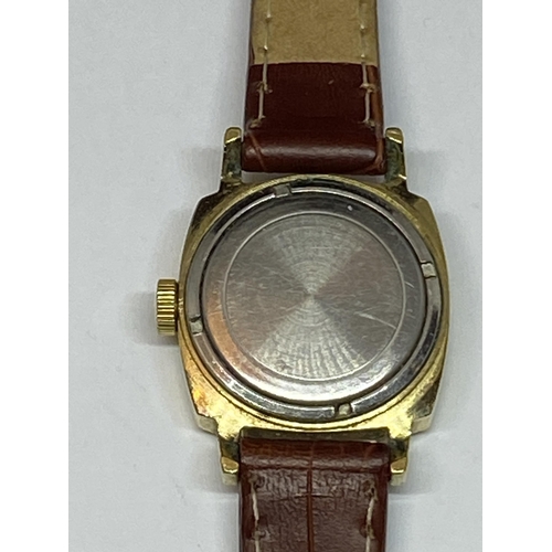 651 - A GOLD PLATED SEKONDA WRIST WATCH WITH LEATHER STRAP SEEN WORKING BUT NO WARRANTY