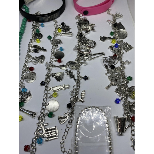 684 - A QUANTITY OF JEWELLERY TO INCLUDE FOUR CHARM BRACELETS