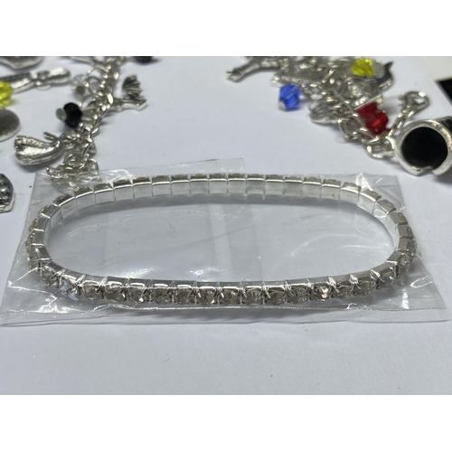 684 - A QUANTITY OF JEWELLERY TO INCLUDE FOUR CHARM BRACELETS