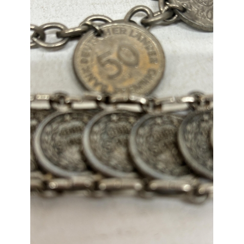 713 - TWO SILVER PLATED BRACELETS WITH COINS