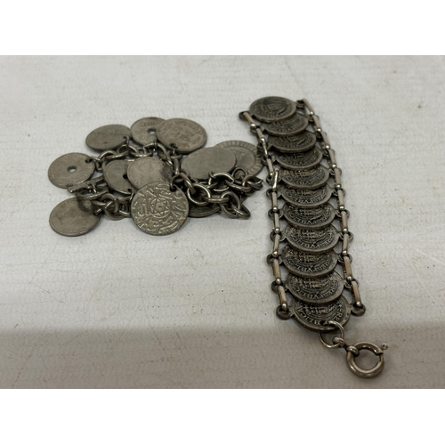 713 - TWO SILVER PLATED BRACELETS WITH COINS