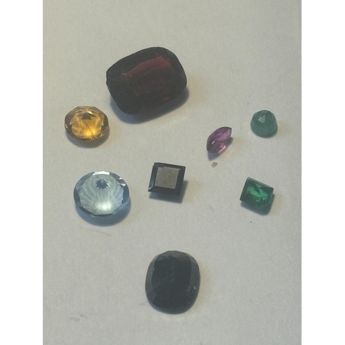 714 - A QUANTITY OF GEMSTONES TO INCLUDE IOLOTE, GARNET, RUBY, EMERALD, SAPPHIRE ETC AND 1 CARAT OF DIAMON... 