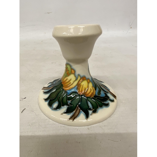 807 - A MOORCROFT CANDLESTICK WINTER ACONITE PATTERN