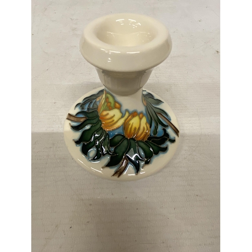 807 - A MOORCROFT CANDLESTICK WINTER ACONITE PATTERN