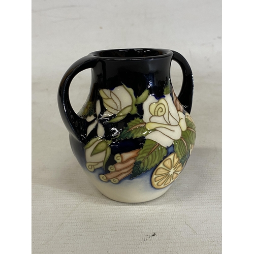 809 - A MOORCROFT TWIN HANDLED VASE AMPULLA PATTERN (N. SLAVEY)