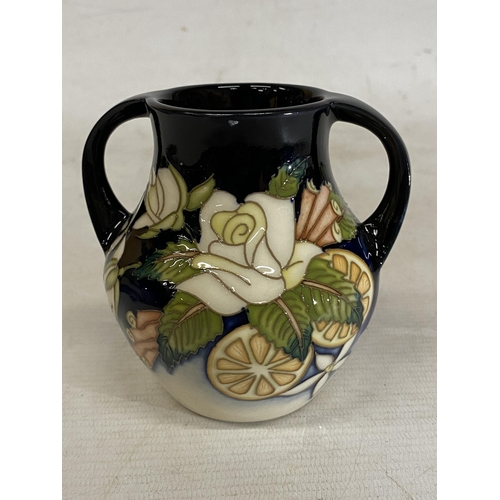 809 - A MOORCROFT TWIN HANDLED VASE AMPULLA PATTERN (N. SLAVEY)