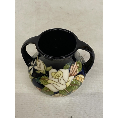 809 - A MOORCROFT TWIN HANDLED VASE AMPULLA PATTERN (N. SLAVEY)