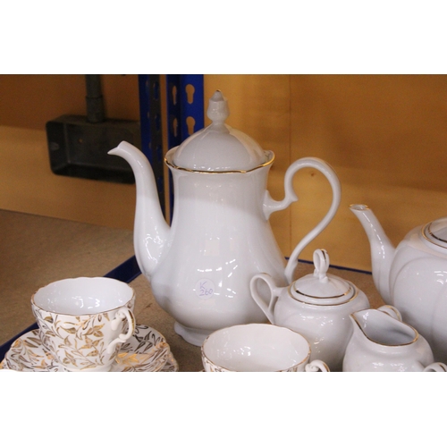 856 - A COLLECTION OF CHINA PLATES, SIDE PLATES, BOWLS, A TEA POT, COFFEE POT, CREAM JUG, SUGAR BOWL, CUPS... 