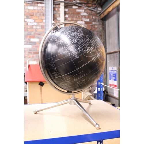 888 - A BLACK STANDING DESK GLOBE WITH A MAP OF THE WORLD