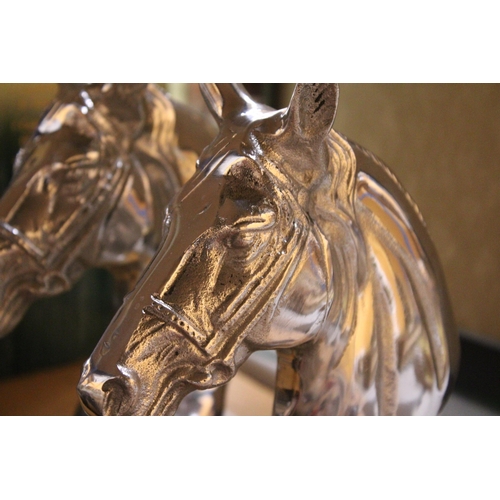 917 - A PAIR OF CHROME HORSES HEADS ON MARBLE BASE HEIGHT 23CM