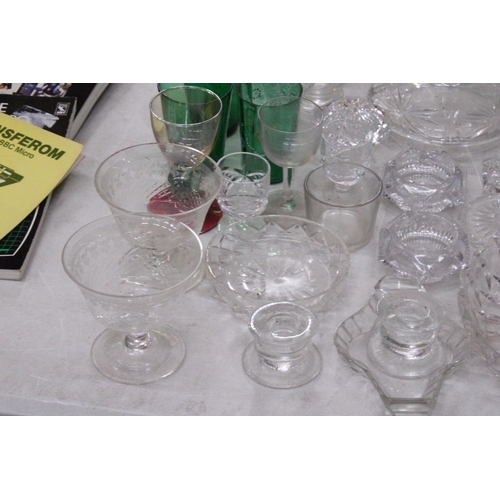 1023 - A LARGE COLLECTION OF GLASSWARE TO INCLUDE A DECAMTER, VASES, DESSERT BOWLS, CANDLE HOLDERS, GLASES,... 