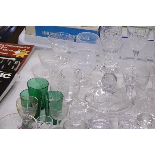 1023 - A LARGE COLLECTION OF GLASSWARE TO INCLUDE A DECAMTER, VASES, DESSERT BOWLS, CANDLE HOLDERS, GLASES,... 