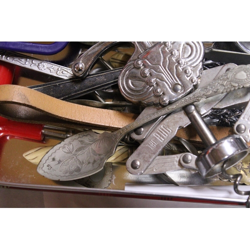 1060 - A QUANTITY OF FLATWARE TO INCLUDE SUGAR TONGS, BOTTLE OPENERS, SERVING SPOONS, ETC