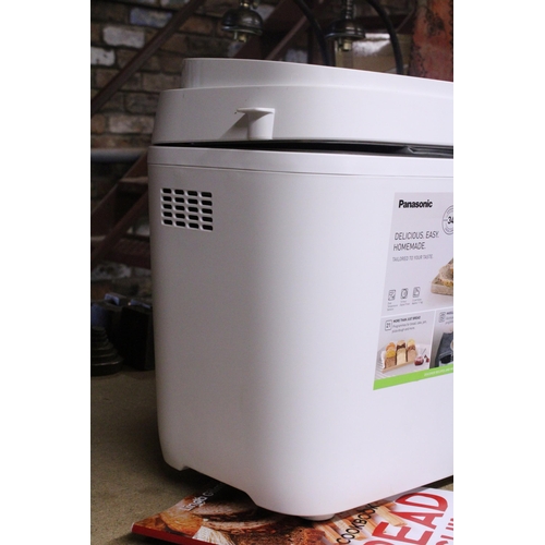 1061 - AN AS NEW PANASONIC AUTOMATIC BREAD MAKER, MODEL NO. SD-B2510, WITH INSTRUCTIONS AND A BREAD COOKERY... 