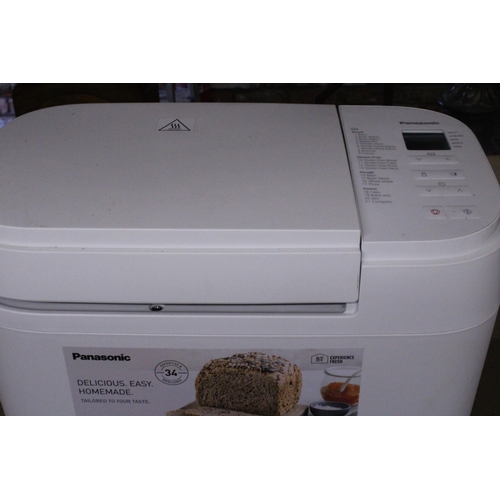 1061 - AN AS NEW PANASONIC AUTOMATIC BREAD MAKER, MODEL NO. SD-B2510, WITH INSTRUCTIONS AND A BREAD COOKERY... 