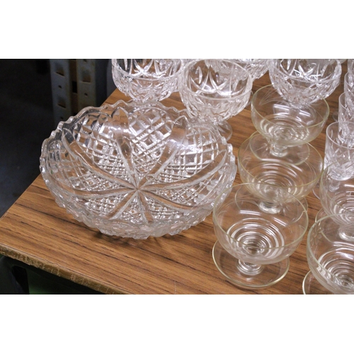 1148 - A LARGE QUANTITY OF GLASS SERVING DISHES AND A BOWL