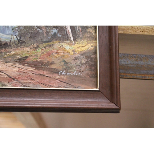 1169 - A FRAMED OIL ON CANVAS OF A WOODLAND COTTAGE SCENE SIGNED TO LOWER RIGHT HAND CORNER 32CM X 41CM