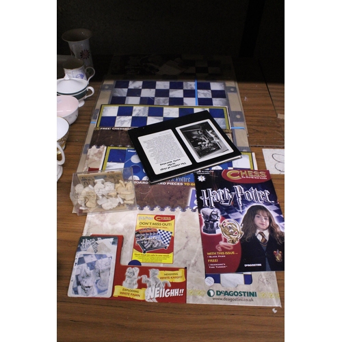 1206 - A COLLECTION OF HARRY POTTER CHESS ITEMS TO INCLUDE CHESS BOARD AND PIECES (NOT COMPLETE)