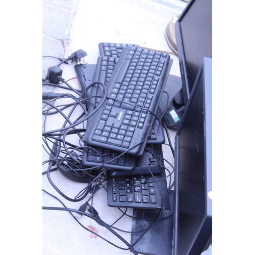 2409 - A LARGE QUANTITY OF COMPUTER MONITORS AND KEYBOARDS ETC