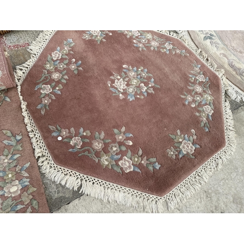 2488 - THREE VARIOUS PINK PATTERNED FRINGED RUGS