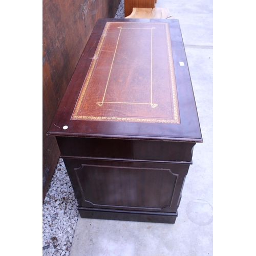 2510 - A MAHOGANY TWIN PEDESTAL DESK ENCLOSING EIGHT DRAWERS WITH INSET LEATHER TOP, 48