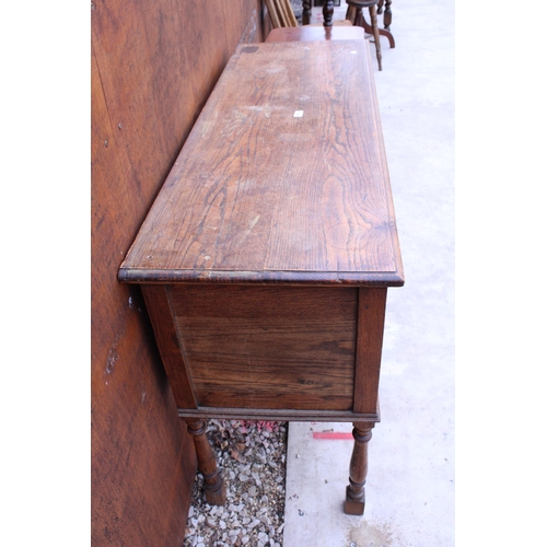 2517A - AN EARLY 20TH CENTURY OAK JACOBEAN STYLE DRESSER WITH TWO DRAWERS ON TURNED LEGS, 54